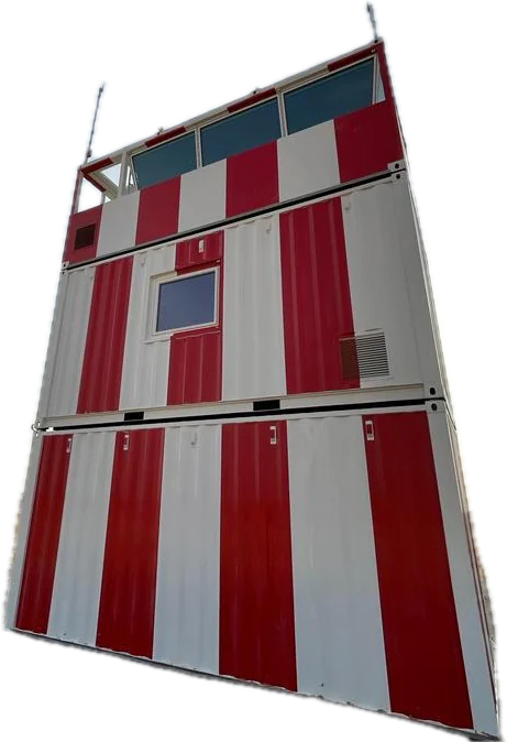 Red and white modular air traffic control tower with a glazed cab